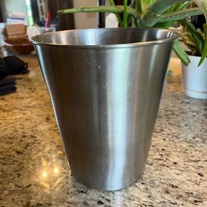 Brushed nickel bathroom trash can, stain on inside